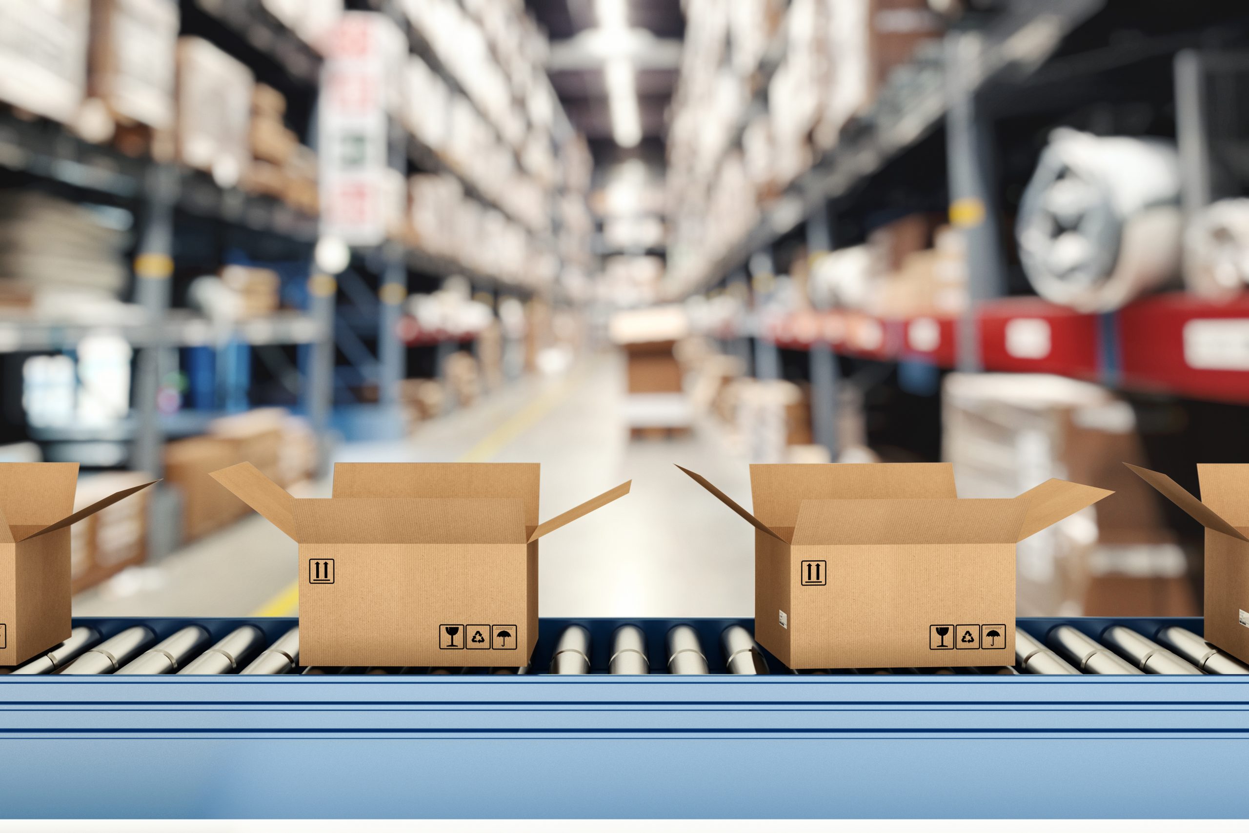 Parcels moving along a conveyor in a fulfilment centre